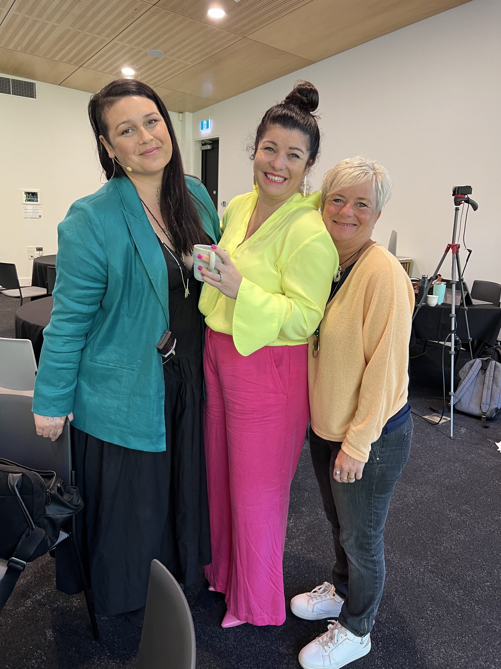 Sarah Greener with two attendees after a Moxie Movement event